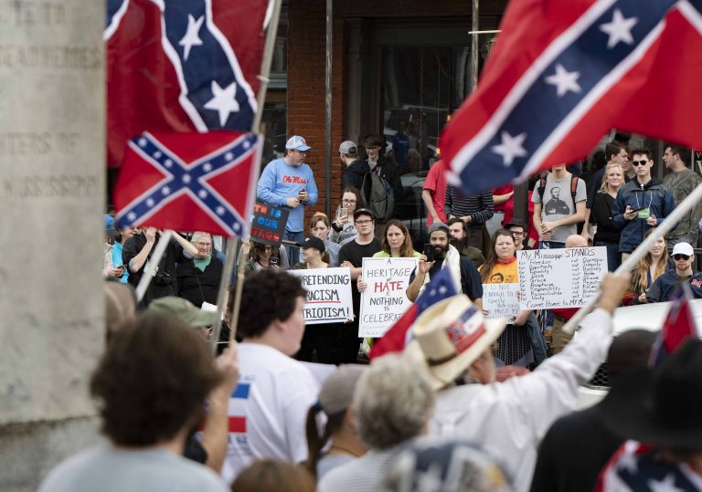 Neo-Confederate protesters march from Oxford Square to Ole Miss campus