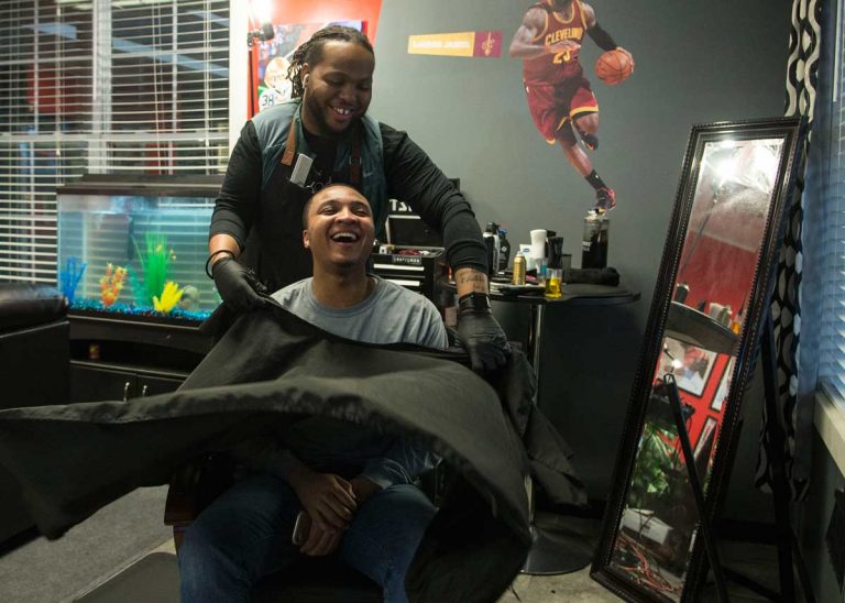 Local barber changes clients hair, brightens attitudes