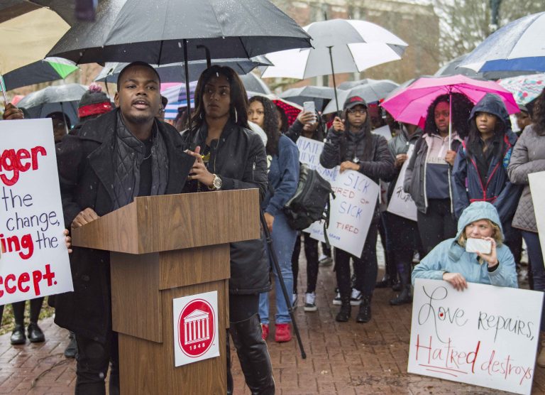 Ole Miss students protest silently at Confederate statue during Black History Month March